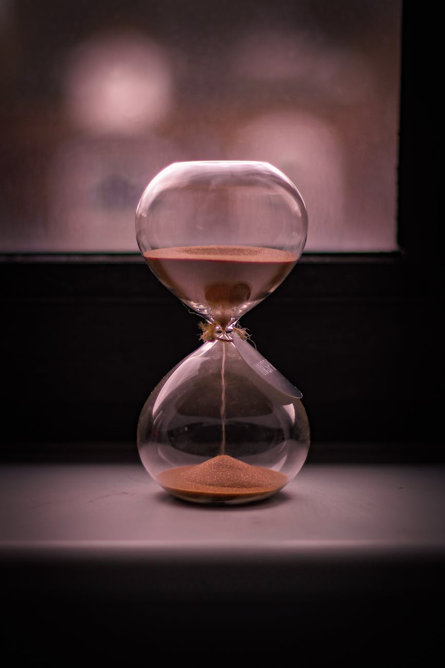 Egg timer with sand pouring and blurry background